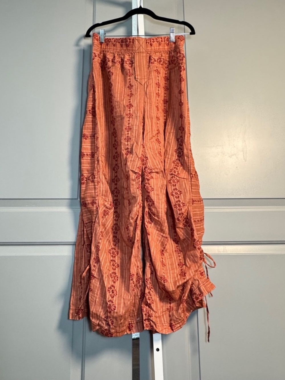 FP Intimately flowy muted  orange with flowers Pant sz M